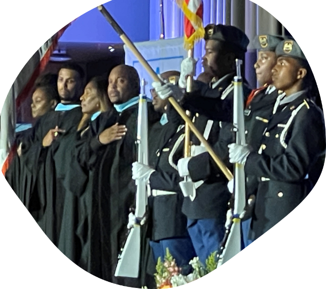 A group of people in uniform holding flags